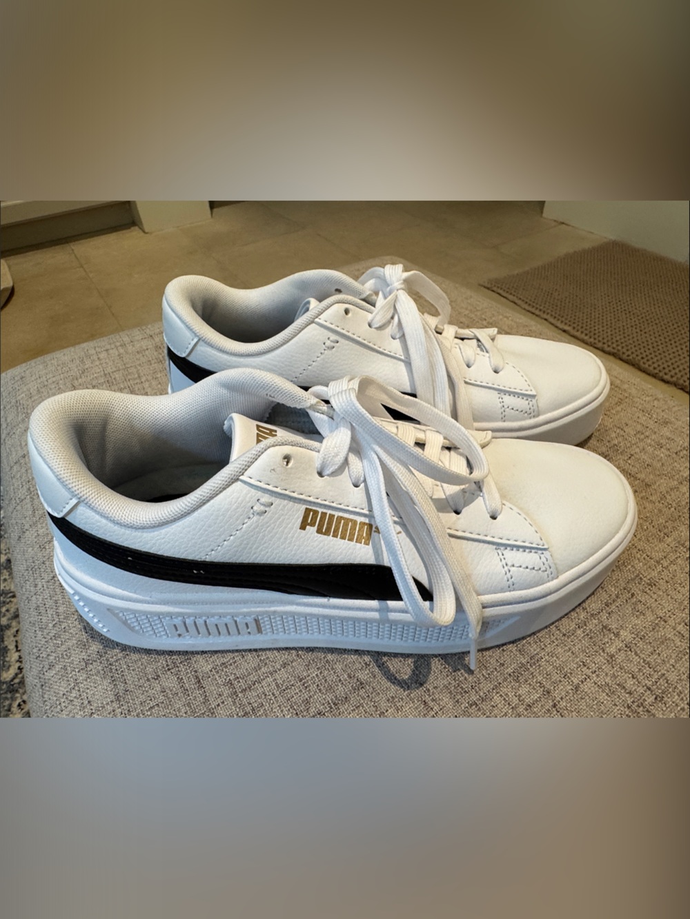 Puma White Low-Top Sneakers with Black Stripe and Gold Logo